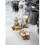 TWO HUMMEL FIGURES, LLADRO FIGURE OF A GIRL WITH A BASKET AND TWO CHINA HEADED BOTTLE CORKS