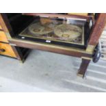 A MAHOGANY OBLONG COFFEE TABLE WITH GLASS ‘MAP’ TOP WITH BRASS BOUND EDGES, ‘H’ STRETCHERS