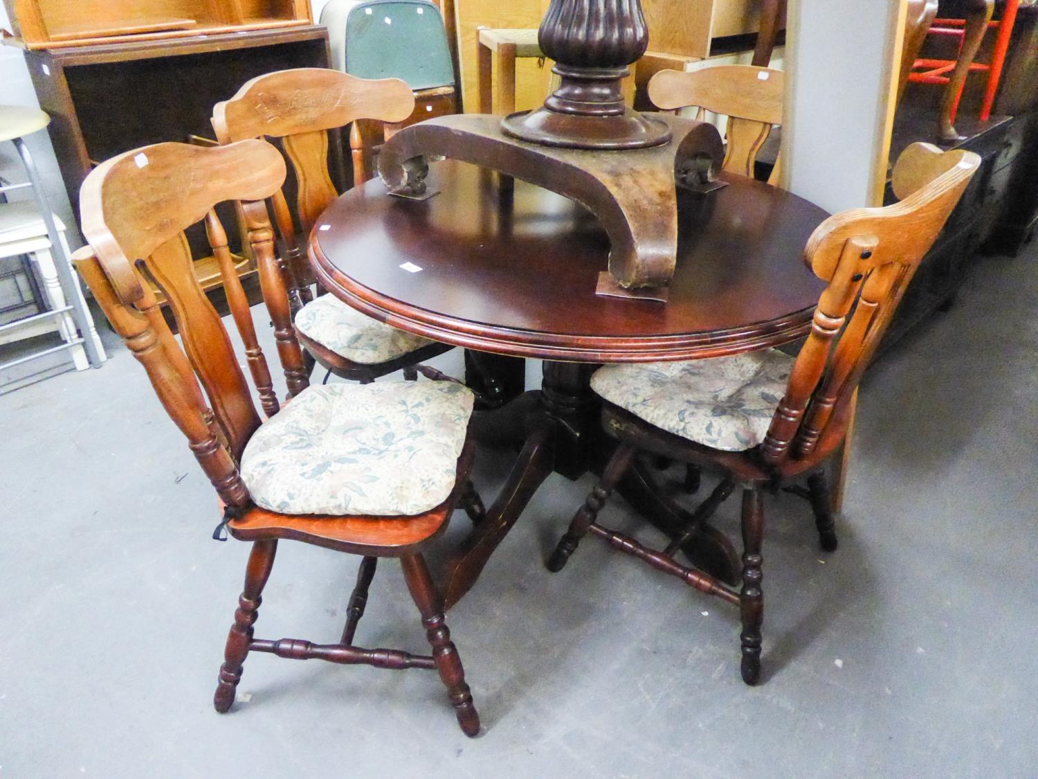 A MODERN CIRCULAR BREAKFAST TABLE AND FOUR MATCHING CHAIRS