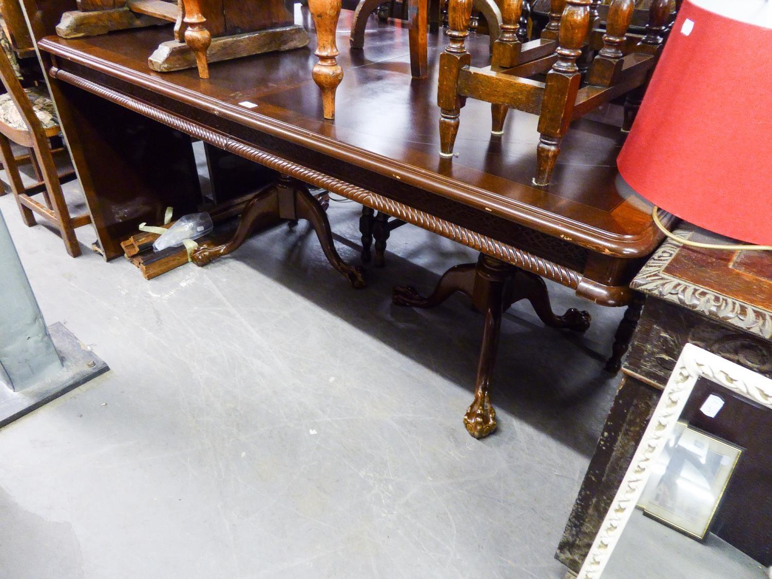 A LARGE INLAID MAHOGANY REPRODUCTION TWIN PEDESTAL DINING TABLE WITH TWO EXTRA LEAVES