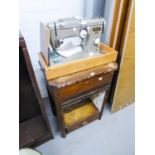 AN ELECTRIC PORTABLE SEWING MACHINE WITH STAND