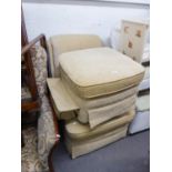 A RECLINING UPHOLSTERED ARMCHAIR AND MATCHING STOOL