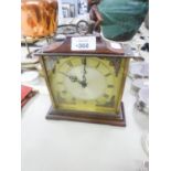 A BATTERY OPERATED MANTEL CLOCK