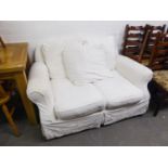 TWO SEATER SETTEE COVERED IN WHITE FABRIC