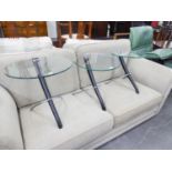 NEST OF THREE STYLISH COFFEE TABLES HAVING GLASS CIRCULAR TOPS AND BLACK AND CHROME LEGS