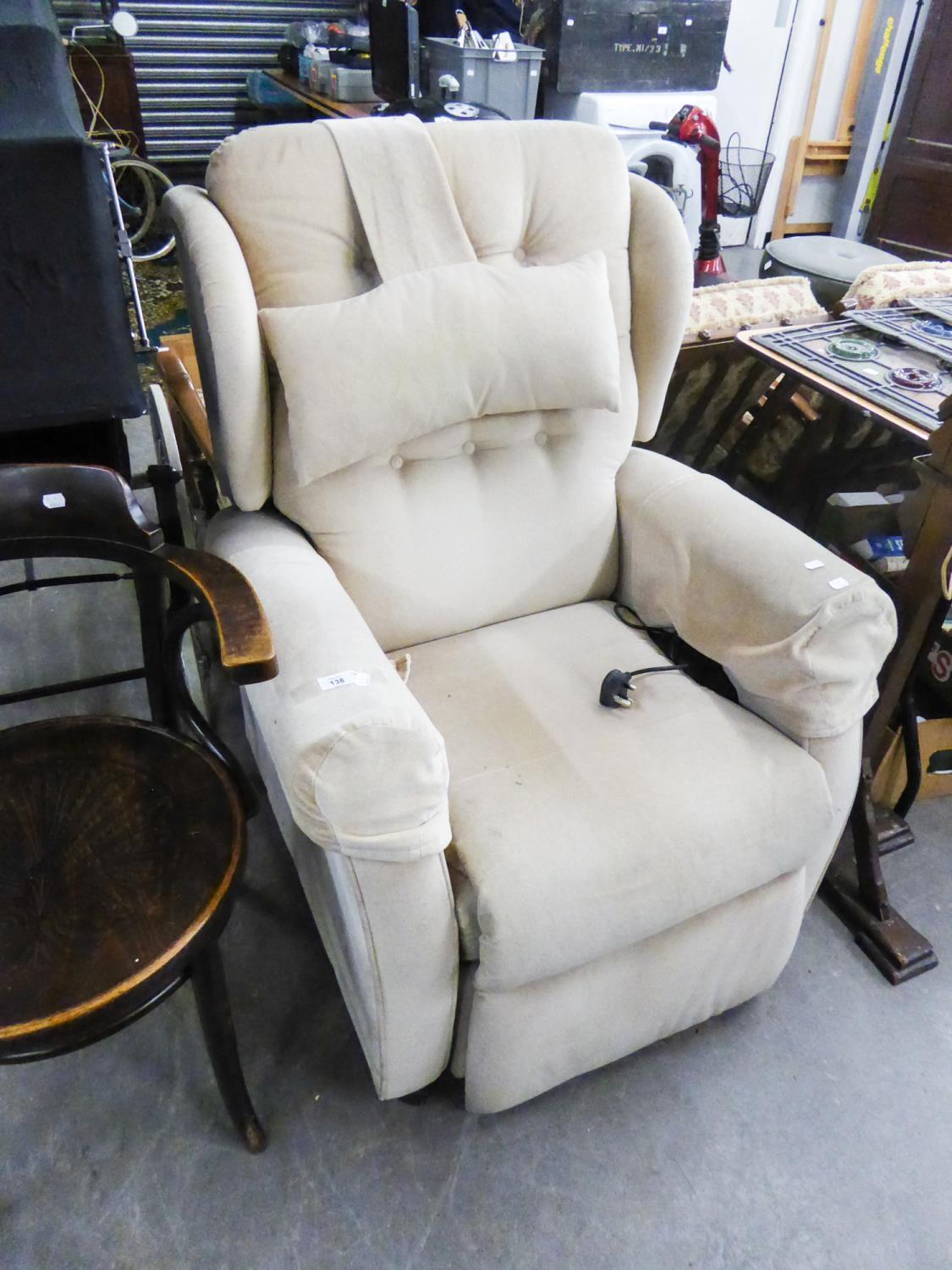 AN ELECTRONICALLY AJUSTABLE LOUNGE CHAIR, BUTTON UHOLSTERED IN MUSHROOM COLOURED VELVET