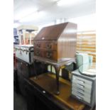 AN EARLY TWENTIETH CENTURY MAHOGANY BUREAU, HAVING SLOPE FRONT OVER LONG DRAWERS