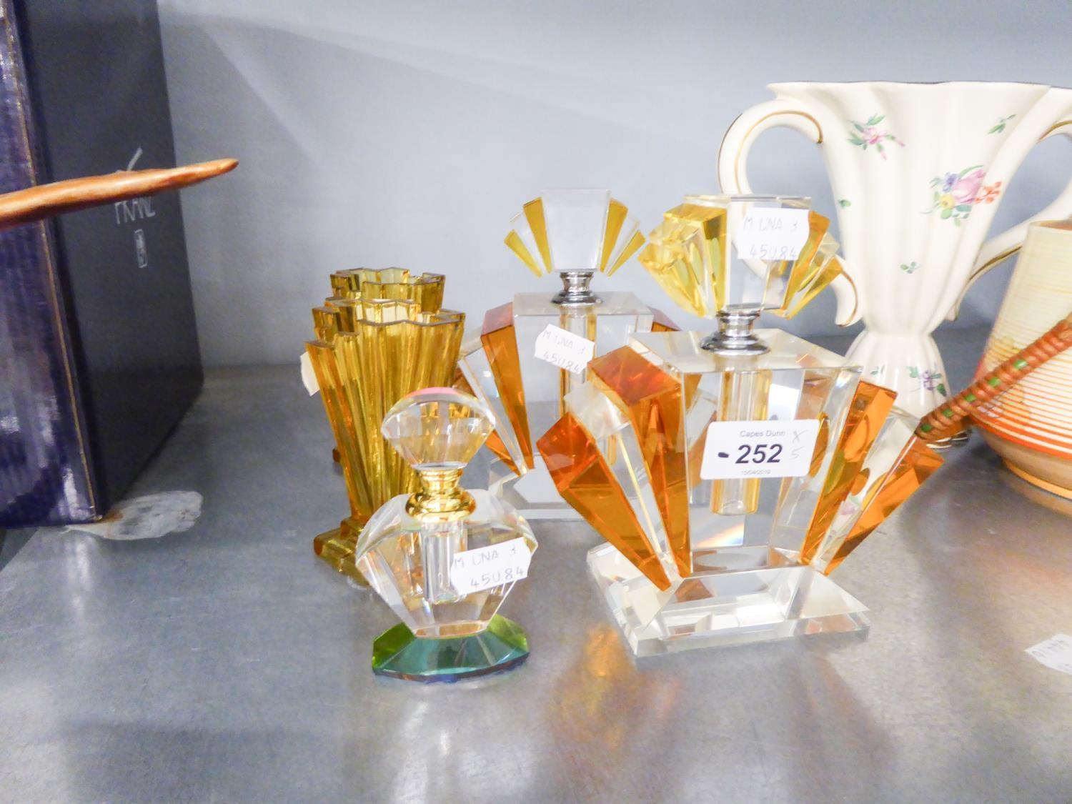 A GROUP OF STYLISH COLOURED ART DECO GLASS ITEMS TO INCLUDE; THREE PERFUME BOTTLES AND TWO VASES (5)