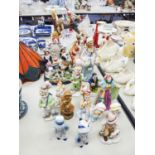 QUANTITY OF CERAMIC FIGURES, ONE WITH CHILDREN PLAYING IN A TREE, TWO STAFFORDSHIRE MODELS OF