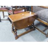 A JACOBEAN STYLE OAK CIRCULAR FALL LEAF COFFEE TABLE WITH SWIVEL TOP, ON BALUSTER LEGS WITH PLAIN