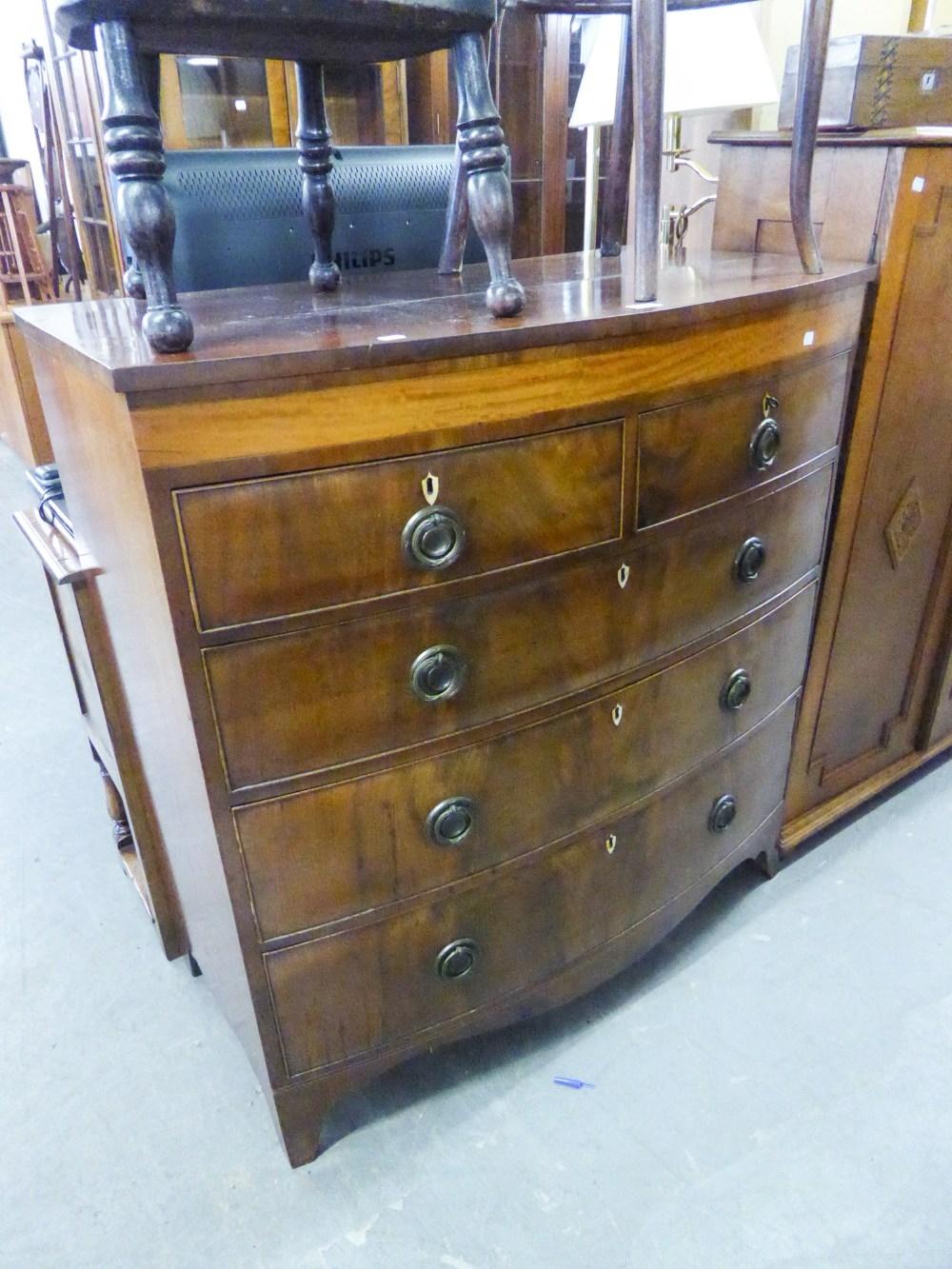 A NINETEENTH CENTURY BOW-FRONTED CHEST OF TWO SHORT OVER THREE LONG DRAWERS ON SPLAYED BRACKET FEET