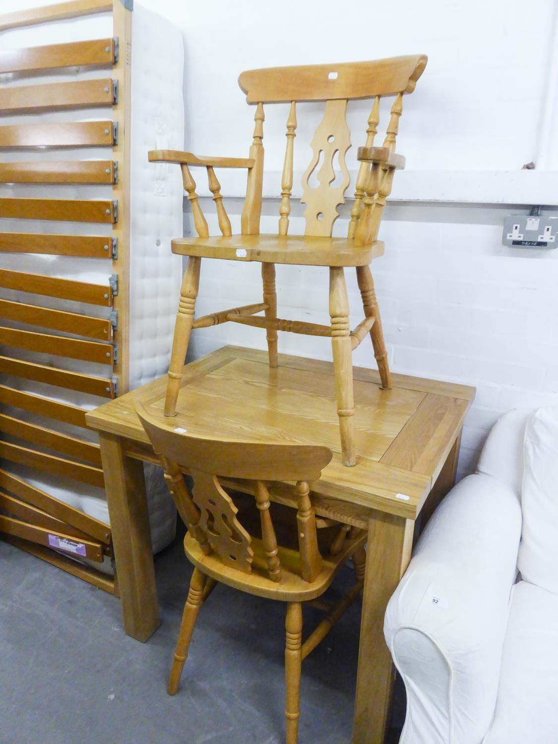 A SMALL GOOD QUALITY LIGHT OAK KITCHEN TABLE AND TWO SIMILAR CARVER DINING CHAIRS (3)