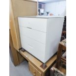 A MODERN WHITE HIGH GLOSS CHEST OF FOUR DRAWERS, RAISED ON STEEL BASE