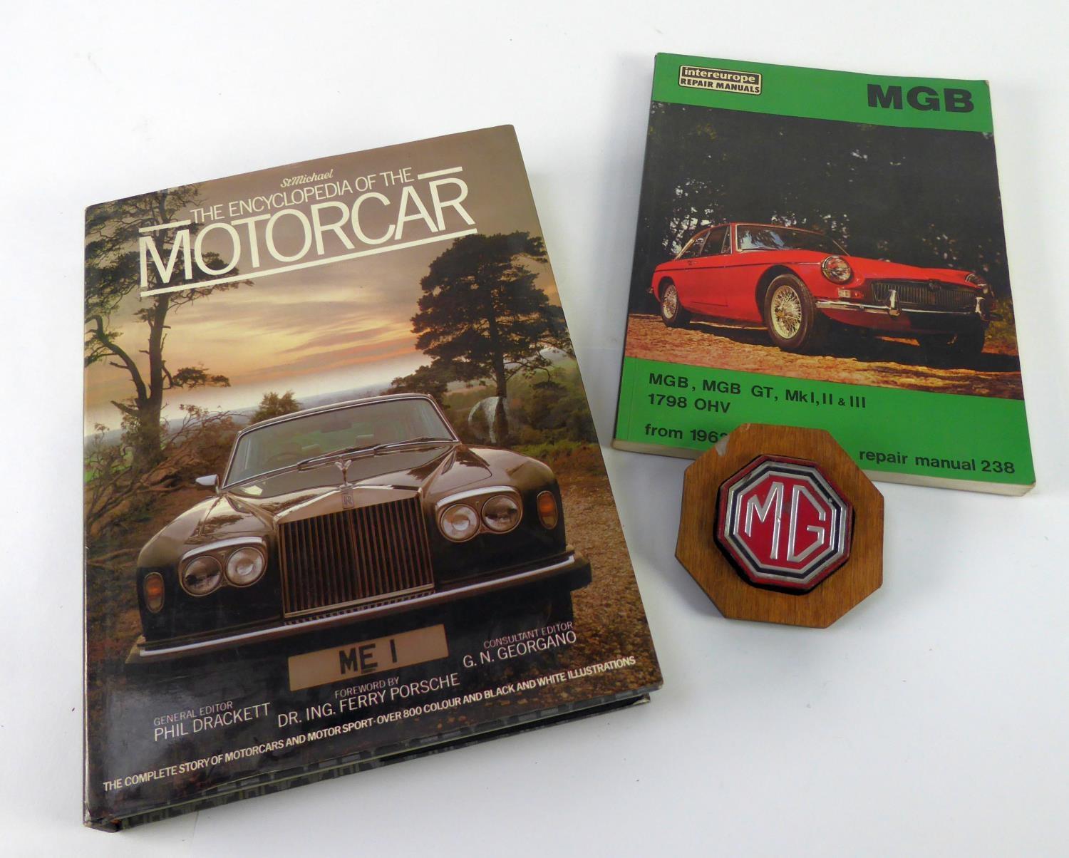 M.G. ENAMELLED MOTORCAR BADGE, octagonal, for bumper mounting, now on a wooden back board; M.G.B.