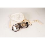 A PAIR OF, VIRTUALLUY AS NEW, GOGGLES, padded brown leather with split glass lenses and aluminium