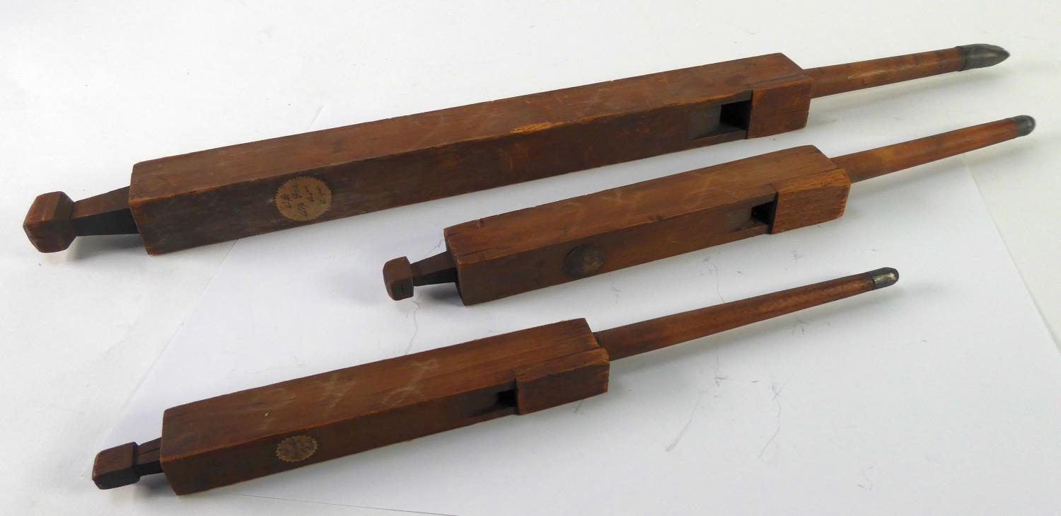 THREE ANTIQUE SOFT WOOD SLIDE WHISTLES, 25", 16 1/2" AND 14 1/2" (63.5 x 41.9 x 36.8cm)