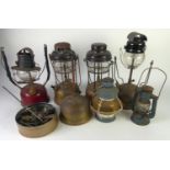 THREE TILLEY LAMPS with brass tanks, ANOTHER with red enamelled tank, two SMALL LANTERNS and part of