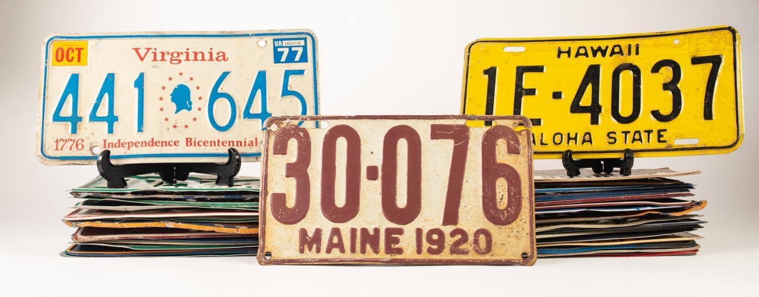 THIRTY FIVE EMBOSSED METAL AND PRINTED CARD AMERICAN AUTOMOBILE NUMBER PLATES, various states,