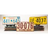 THIRTY FIVE EMBOSSED METAL AND PRINTED CARD AMERICAN AUTOMOBILE NUMBER PLATES, various states,