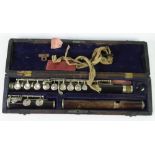 C. LACROIX, EARLY TWENTIETH CENTURY THREE PART ROSEWOOD FLUTE, the plated metal fittings with a