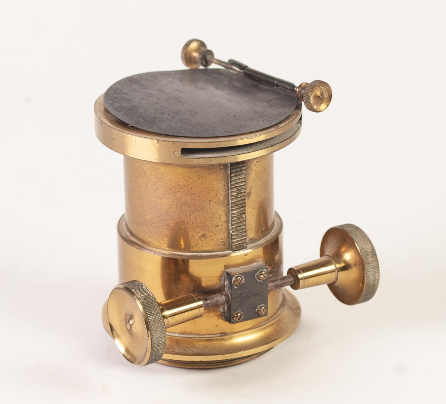 NINETEENTH CENTURY LACQUERED BRASS MAGIC LANTERN LENS, having 2"(5cm) diameter, main lens with