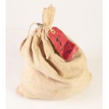 CREAM CLOTH BANK BAG CONTAINING FIVE POUNDS WORTH OF UNCIRCLULATED 1969, ONE PENNY COINS, tied