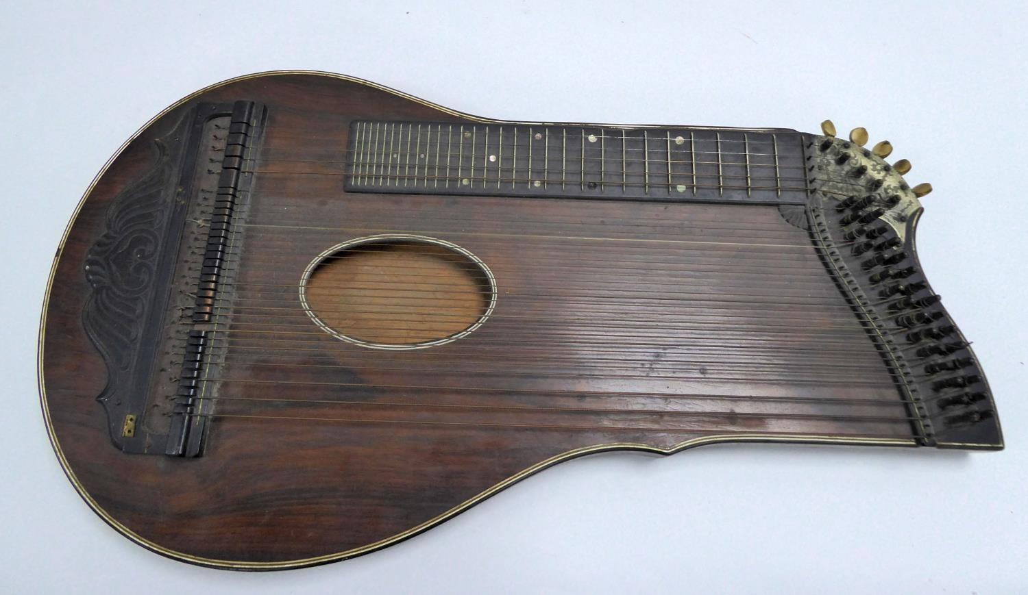 LINE INLAID ROSEWOOD ZITHER, with ivory feet and pegs, 26 ½” x 14” (67.3cm x 35.6cm), a/f