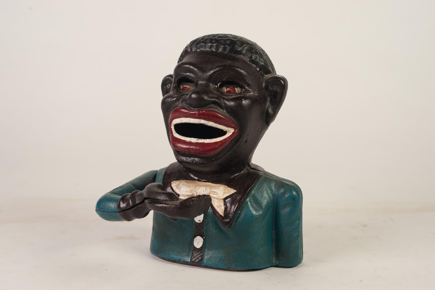 EARLY TWENTIETH CENTURY CAST IRON 'JOLLY' MONEY BANK, of typical form but repainted, the base