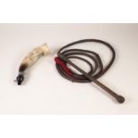 BRAIDED BROWN LEATHER BULL WHIP, the stiff handle with, 8'6" long excluding cotton fabric tail and a