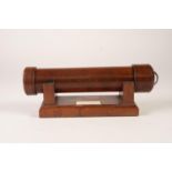 ‘handcrafted by Des Schnugh’, MODERN TURNED SATIN BIRCH KALEIDOSCOPE ON WALNUT STAND, 10” (25.4cm)