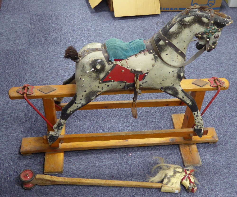 MID CHILD'S TRIANG MEDIUM SIZED CARVED AND PAINTED WOOD PLATFORM ROCKING HORSE, with leather tack