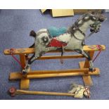 MID CHILD'S TRIANG MEDIUM SIZED CARVED AND PAINTED WOOD PLATFORM ROCKING HORSE, with leather tack