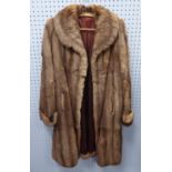 A LIGHT BROWN RABBIT LADIES COAT having out turned collar and cuffs, front seem pockets and a DARK