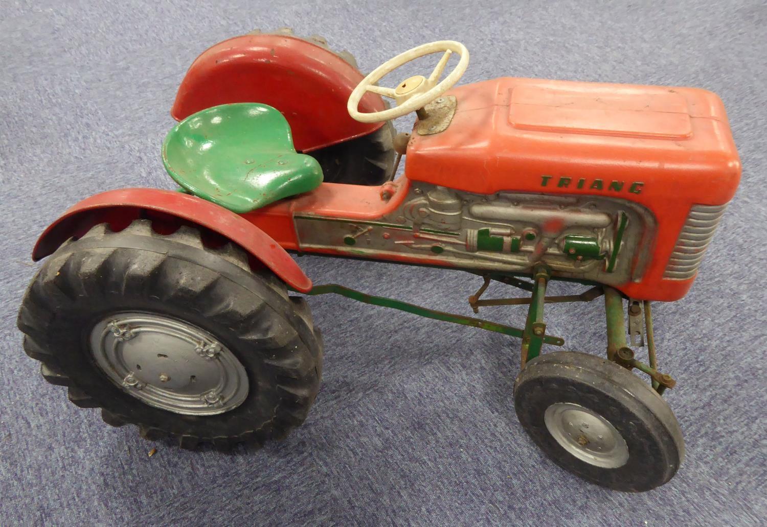 CHILD'S TRIANG VINTAGE PUSH-PEDAL DRIVEN TRACTOR with red metal bodywork, solid rubber heavy duty