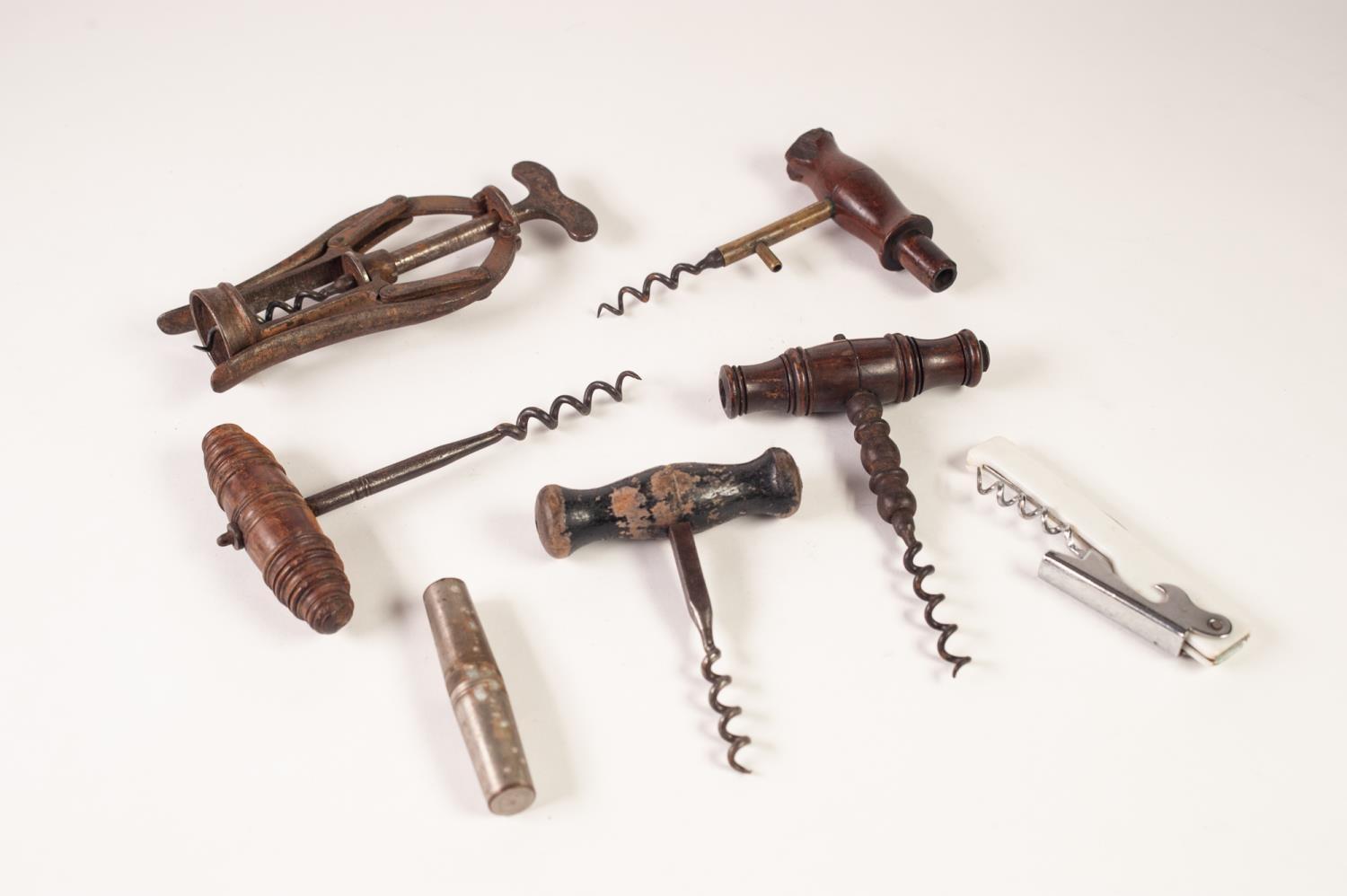 COLLECTION OF SEVEN VINTAGE/ ANTIQUE CORKSCREWS, including: TWO CAST STEEL EXAMPLES WITH WOODEN