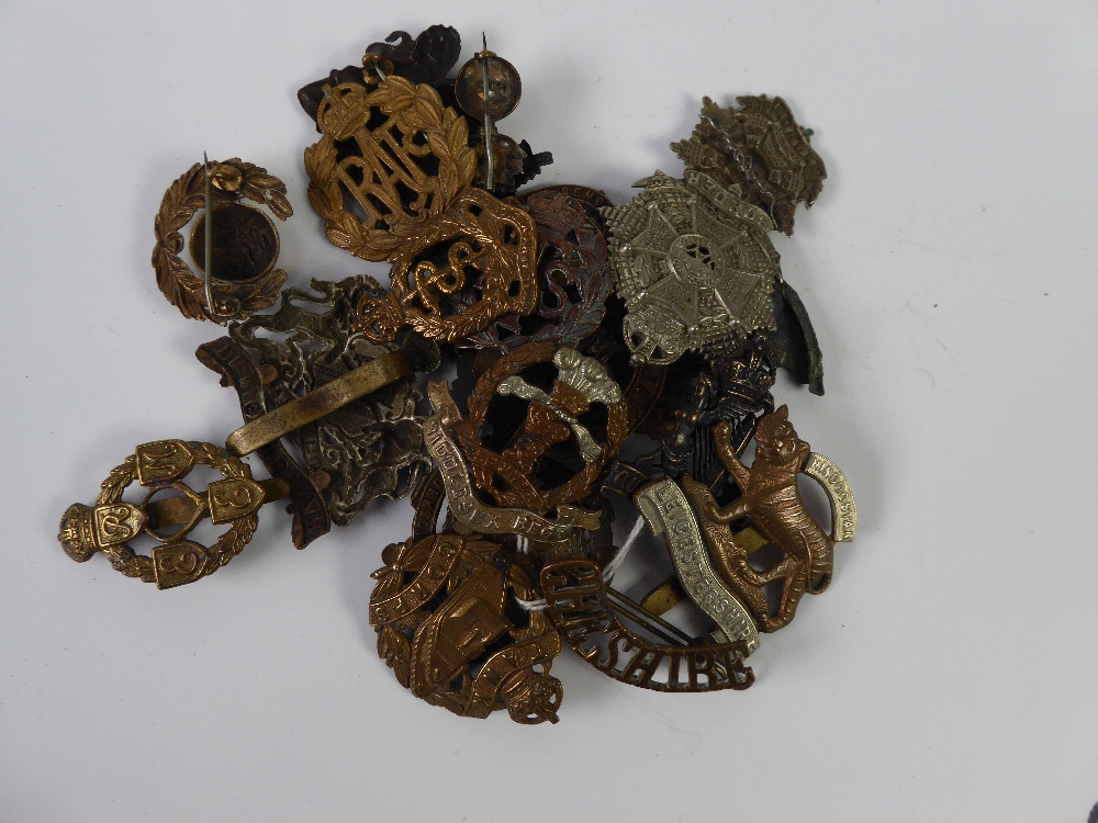 SELECTION OF GREAT WAR AND LATER MILITARY BADGES to include; Tank Corps, Manchester regiment in