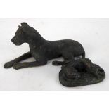 LATE NINETEENTH CENTURY CAST BRONZE MODEL OF A RECUMBENT DOG POSSIBLY A LURCHER, on a naturalistic