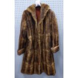 A 3/4 LENGTH LADIES MINK COAT of mid brown colour, out turned collar and cuffs, front seem pockets