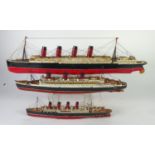 THREE WELL CONSTRUCTED AND PAINTED PLASTIC SHIP MODELS viz the 'Lucitania', 27" (68.5cm) long, '