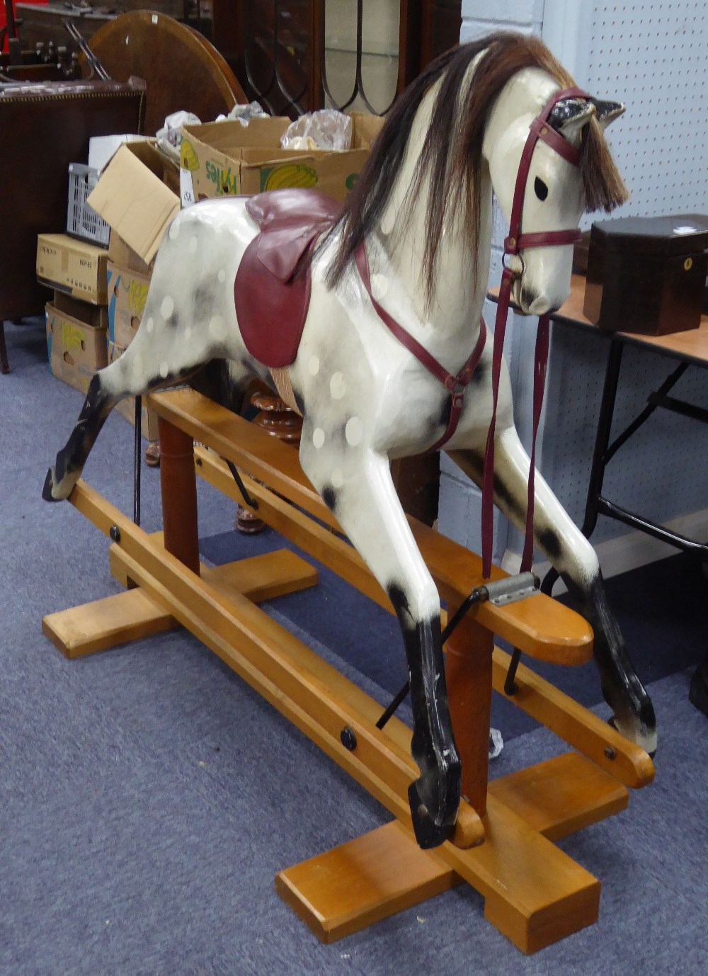 RELKO MEDIUM SIZED HAND CARVED ROCKING HORSE, LATE 20TH CENTURY, white with black painted detail and