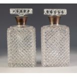 GEORGE VI PAIR OF CUT GLASS DECANTERS AND STOPPERS WITH SILVER COLLARS, f oblong form with