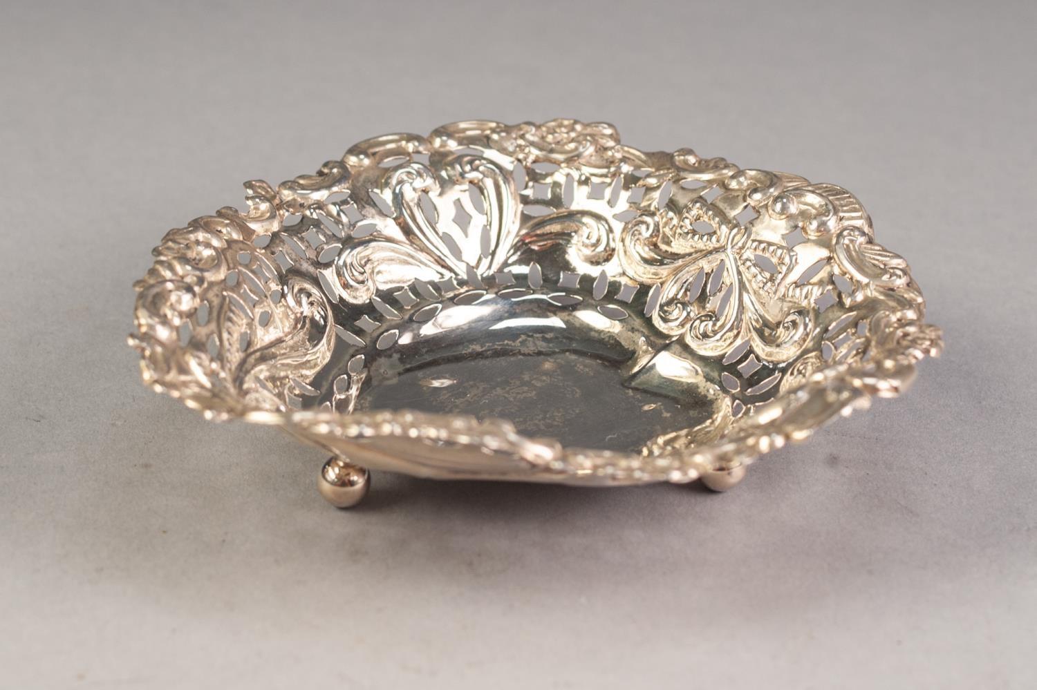 LATE VICTORIAN PIERCED SILVER HEART SHAPED BON BON DISH, on ball feet, 4â€ x 4 Â¼â€, Chester 1900,