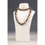 CHINESE SINGLE STRAND NECKLACE OF ALTERNATED PIERCED, HOLLOW, CLOISONNE STYLE BEADS AND TIGERS EYE