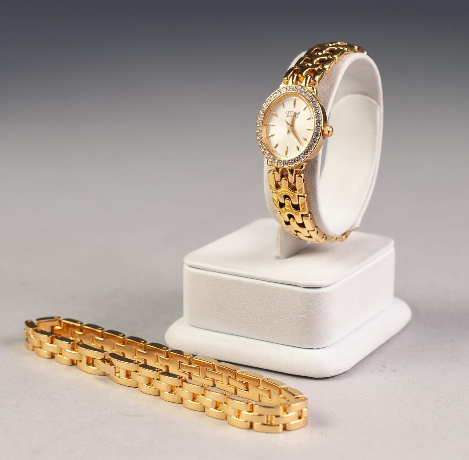 LADY'S CITIZEN QUARTZ GOLD PLATED BRACELET WATCH the small oval dial with batons, paste set besel