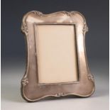 EARLY 20th CENTURY SILVER FACED PHOTOGRAPH FRAME with scrolliated border, Birmingham 1920