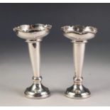 PAIR OF SILVER VASES OF TRUMPET SHAPE having a wavy rim to a weighted base, Sheffield, 1944, James