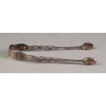 PAIR OF GEORGIAN FANCY SILVER SUGAR TONGS, with pierced arms and acorn pattern bowls, a/f, 5 Â¼