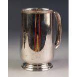 GEORGE VI SILVER TANKARD, of plain, footed form with loop handle, initialled, 5 Â¼â€ (13.3cm) high,