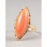 14ct GOLD RING, with a marquise shaped cabochon pink coral, in a fancy collet setting