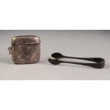 AN EDWARDIAN SILVER LARGE CURVED OBLONG VESTA CASE, foliate scroll engraved, Birmingham 1905 and a